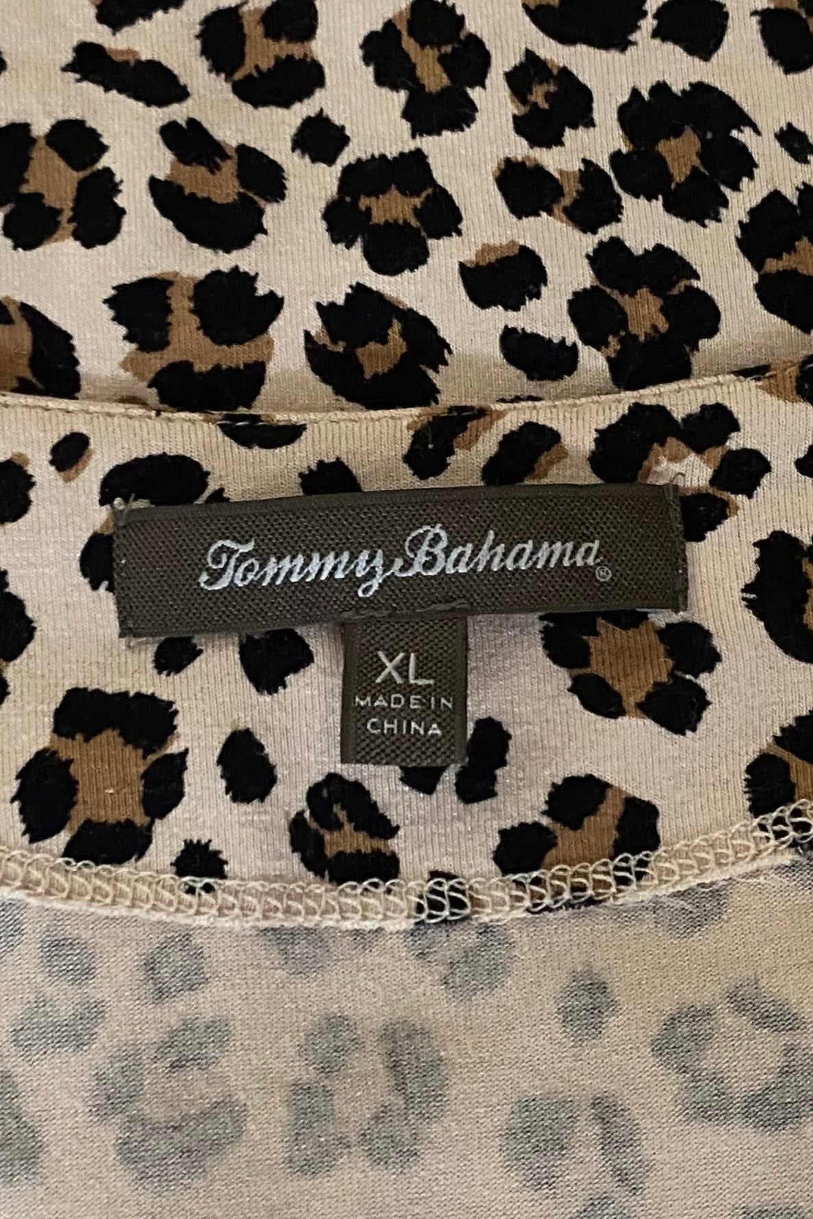 Product tag and label for the Tommy Bahama leopard print faux wrap dress in midsize XL