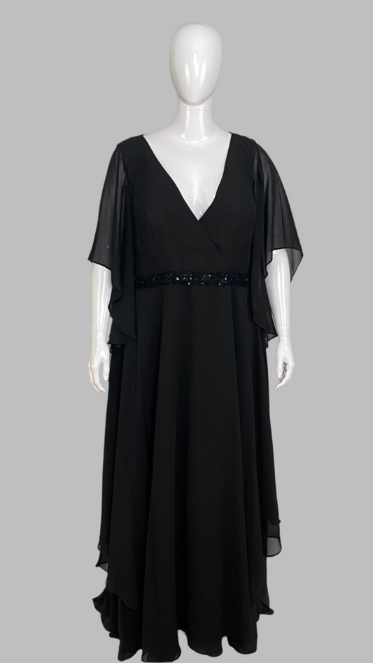 Black evening gown on a mannequin against a white background