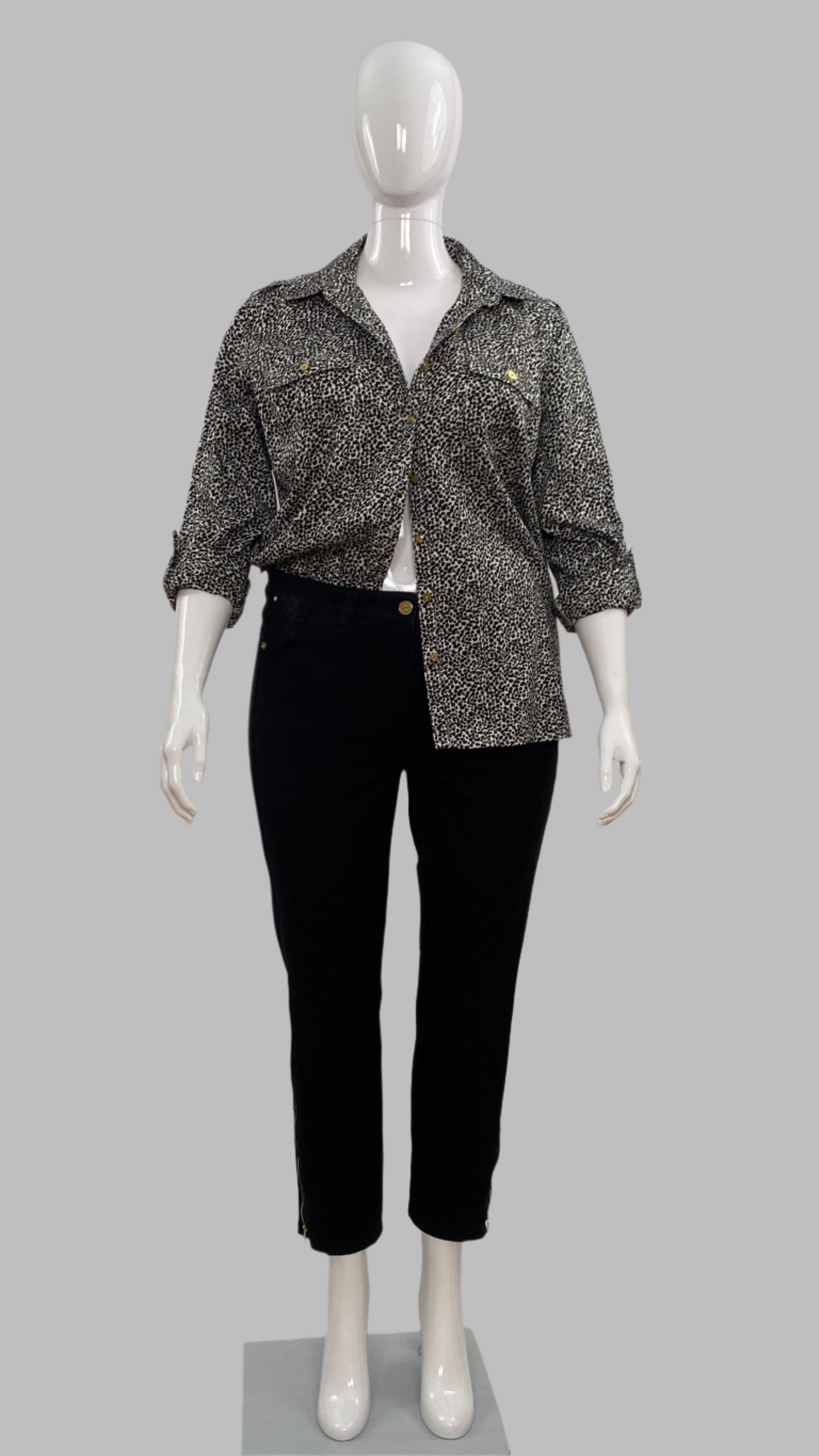 Front view of Jaclyn Smith 100% black and white cotton animal print shirt in size L styled with black Basler jeans. 