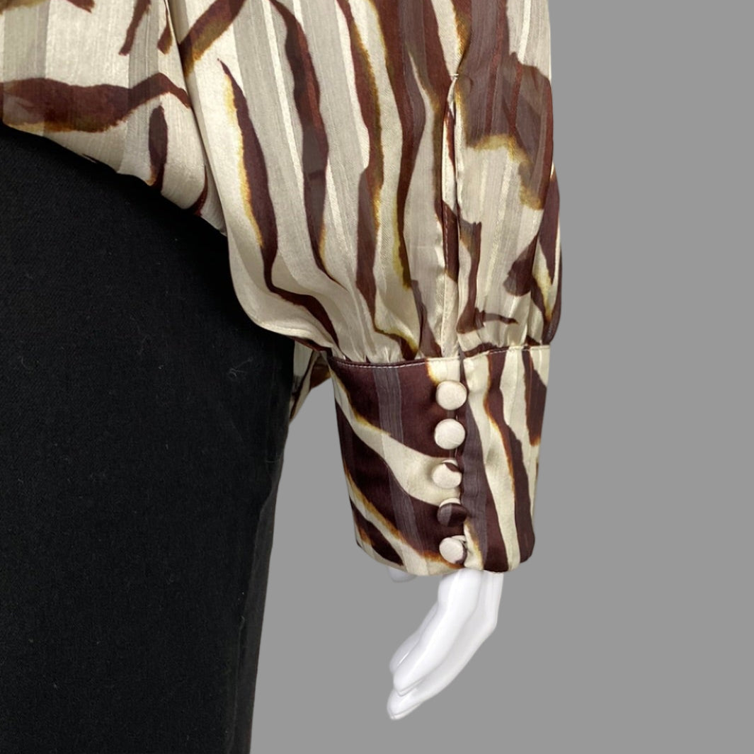 Close up of Melanie Lyne Animal Print Blouse buttons in Plus Size 20
