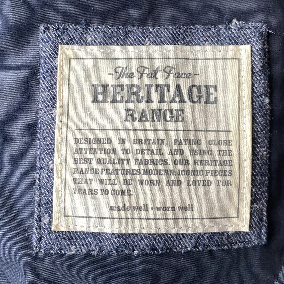 Label of the FatFace Blue Down & Feather puffer Vest in midsize 14